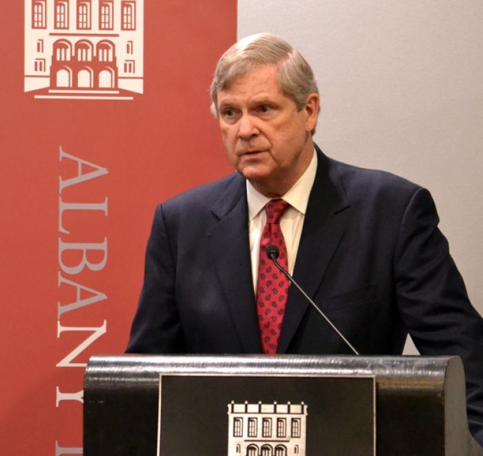 Tom Vilsack wearing a suit and tie